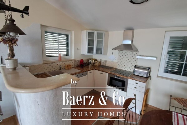 photo 3 Brač, Supetar, a house with a total area of 372 m² located on a plot of 411 m².